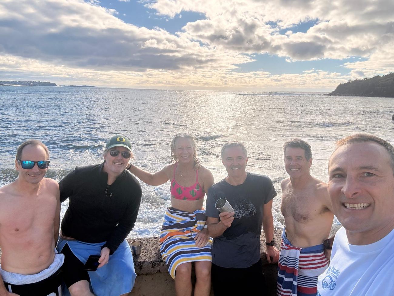 Six runners at the sea wall, winter light